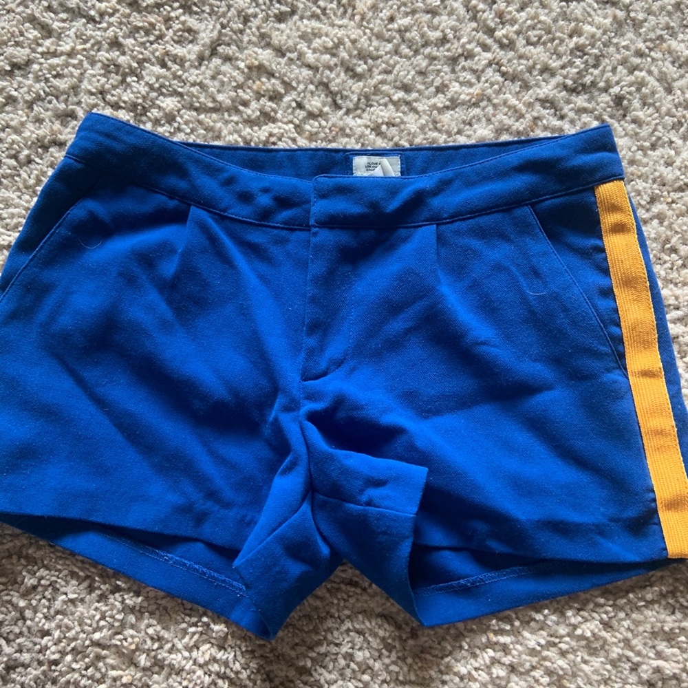 Blue shorts with yellow stripe
